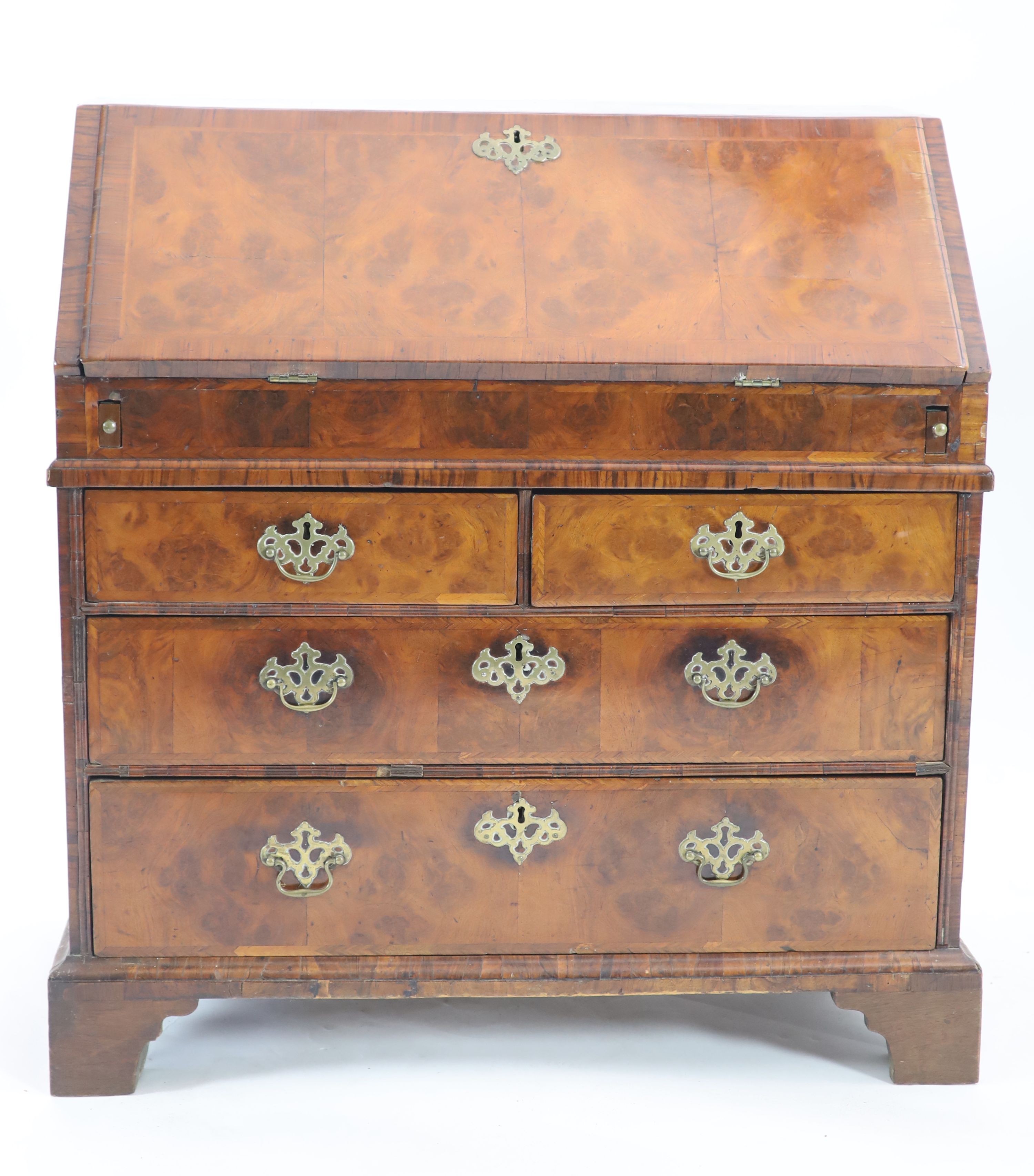 A George I walnut bureau, W.94cm D.52cm H.99cm